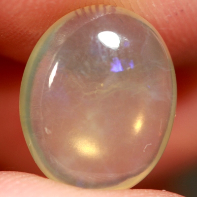 SOLID CRYSTAL OPAL Transparent with purple moving within